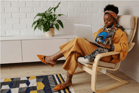 Duolingo: Speak about the photo-An African Woman Using a Laptop