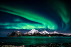 Duolingo write about the photo: The Northern Lights and Snow-Capped Serenity