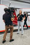 Duolingo write about the photo: On-Scene Reporting at the Track
