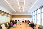 Duolingo write about the photo: A Professional Meeting in a Modern Conference Room