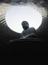 Duolingo Write About the Photo: Serene Buddha in Modern Sanctuary