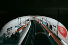 Duolingo Write About the Photo: Commuters in a Tunnel of Light