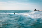 Duolingo Speak about the Photo: A Lone Figure Amidst the Waves