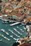 Duolingo Speak about the Photo: A Seaside Town with Historic Charm